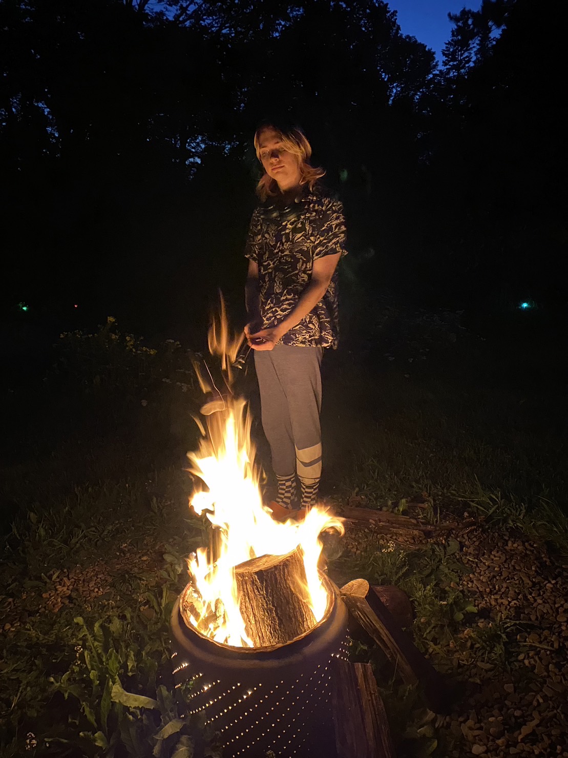 Peter roasts a marshmallow after sunset